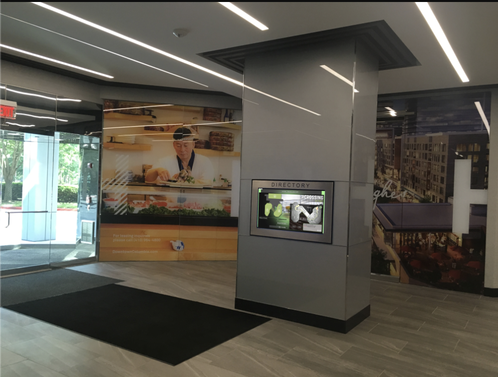 Digital signage in a lobby advertising amenities